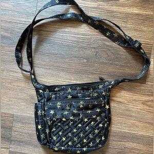 Lug Flutter SE crossbody purse in faded star pattern.